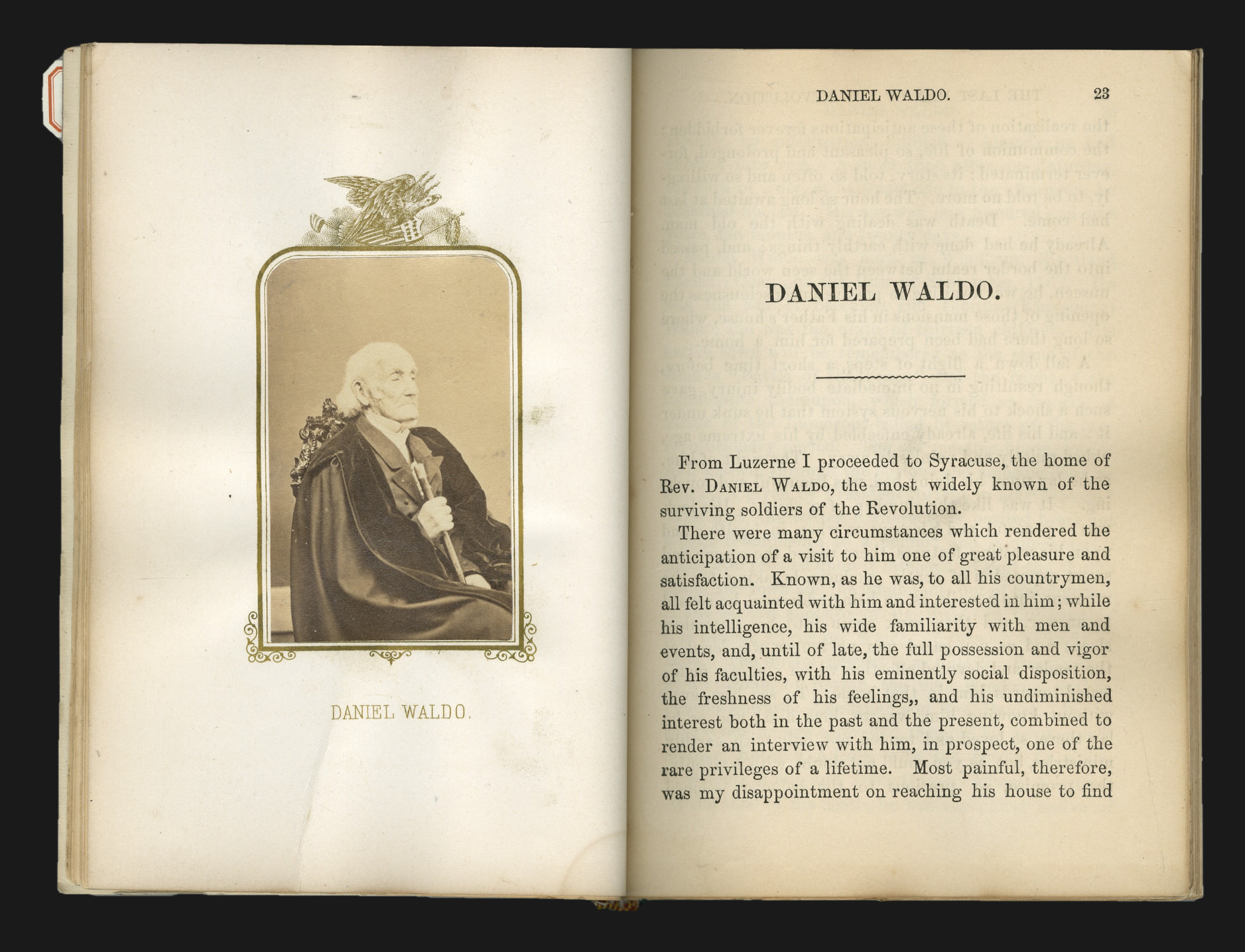 Open book spread with a hand-tipped carte-de-visite albumen portrait of the Rev. Daniel Waldo in clerical cloak, facing the opening page of his biographical sketch at page 23.