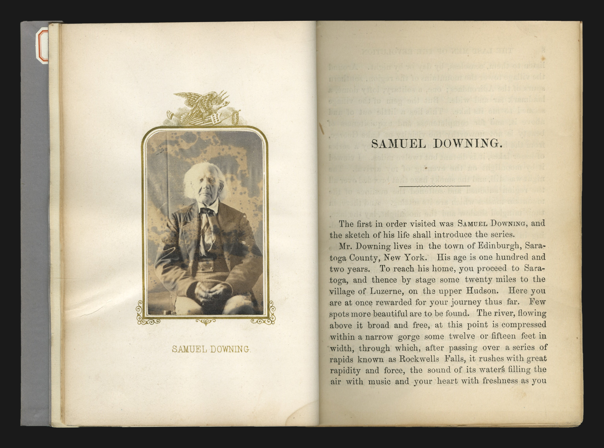 Open book spread with a hand-tipped carte-de-visite albumen portrait of Samuel Downing in a gilt frame surmounted by an engraved eagle, facing the opening page of his biographical sketch.